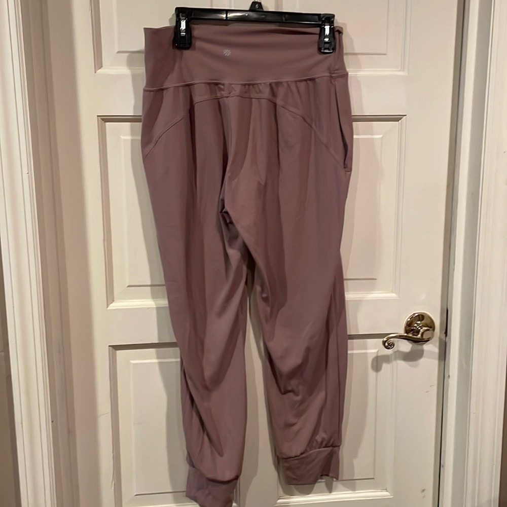 Athleta mauve color work out pant elastic bottom size L